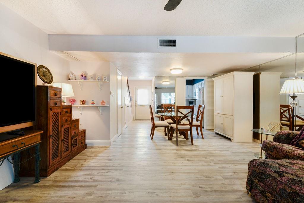 933 Roaring Springs Road Fort Worth, TX 76114 - Photo 6 of 25 a living room with furniture and a flat screen tv