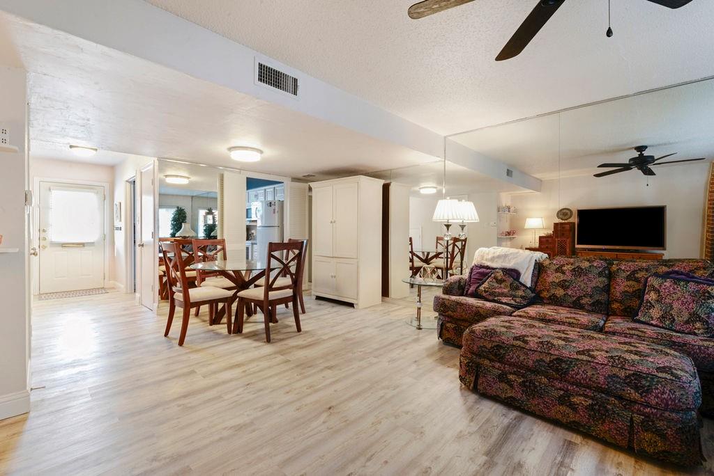 933 Roaring Springs Road Fort Worth, TX 76114 - Photo 9 of 25 a living room with furniture and a flat screen tv