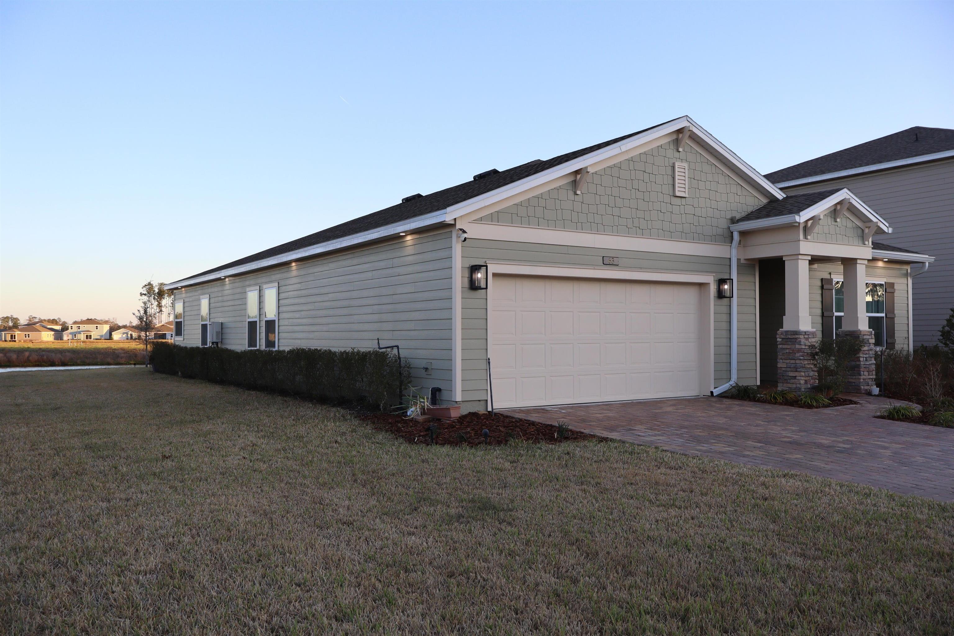 63 Quicksilver Way St. Augustine, FL 32092 - Photo 16 of 36 a view of a house with backyard