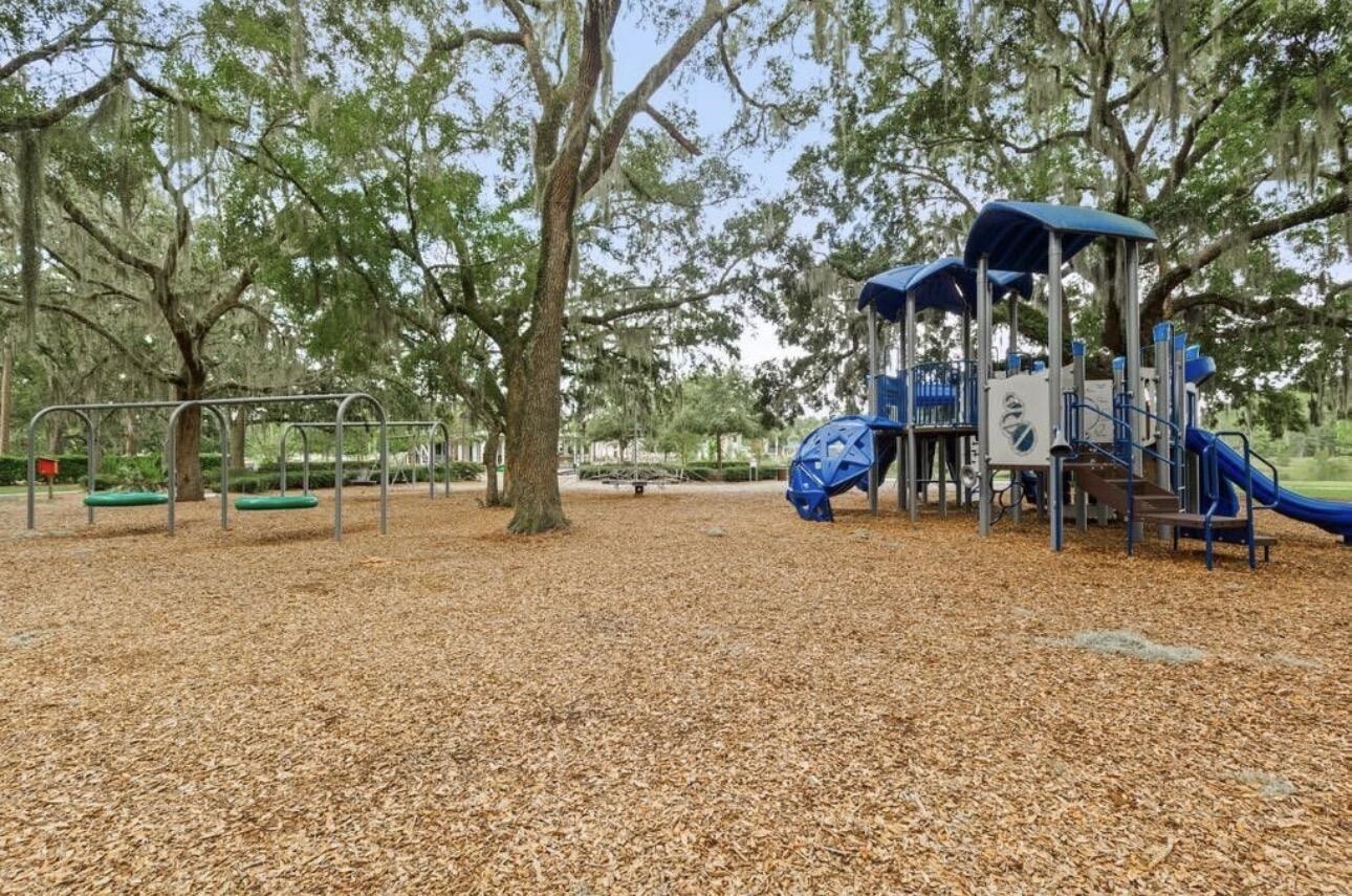 63 Quicksilver Way St. Augustine, FL 32092 - Photo 19 of 36 a view of street with tall trees