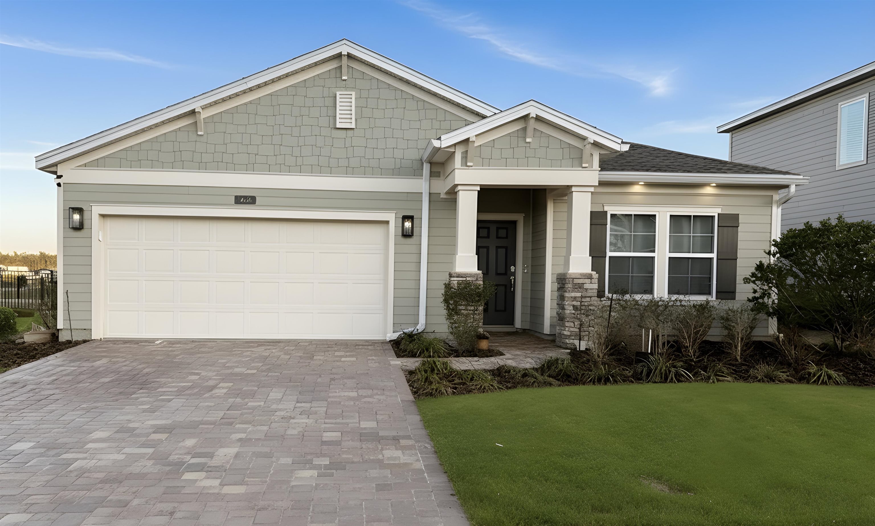 63 Quicksilver Way St. Augustine, FL 32092 - Photo 20 of 36 a front view of a house with a yard and garage