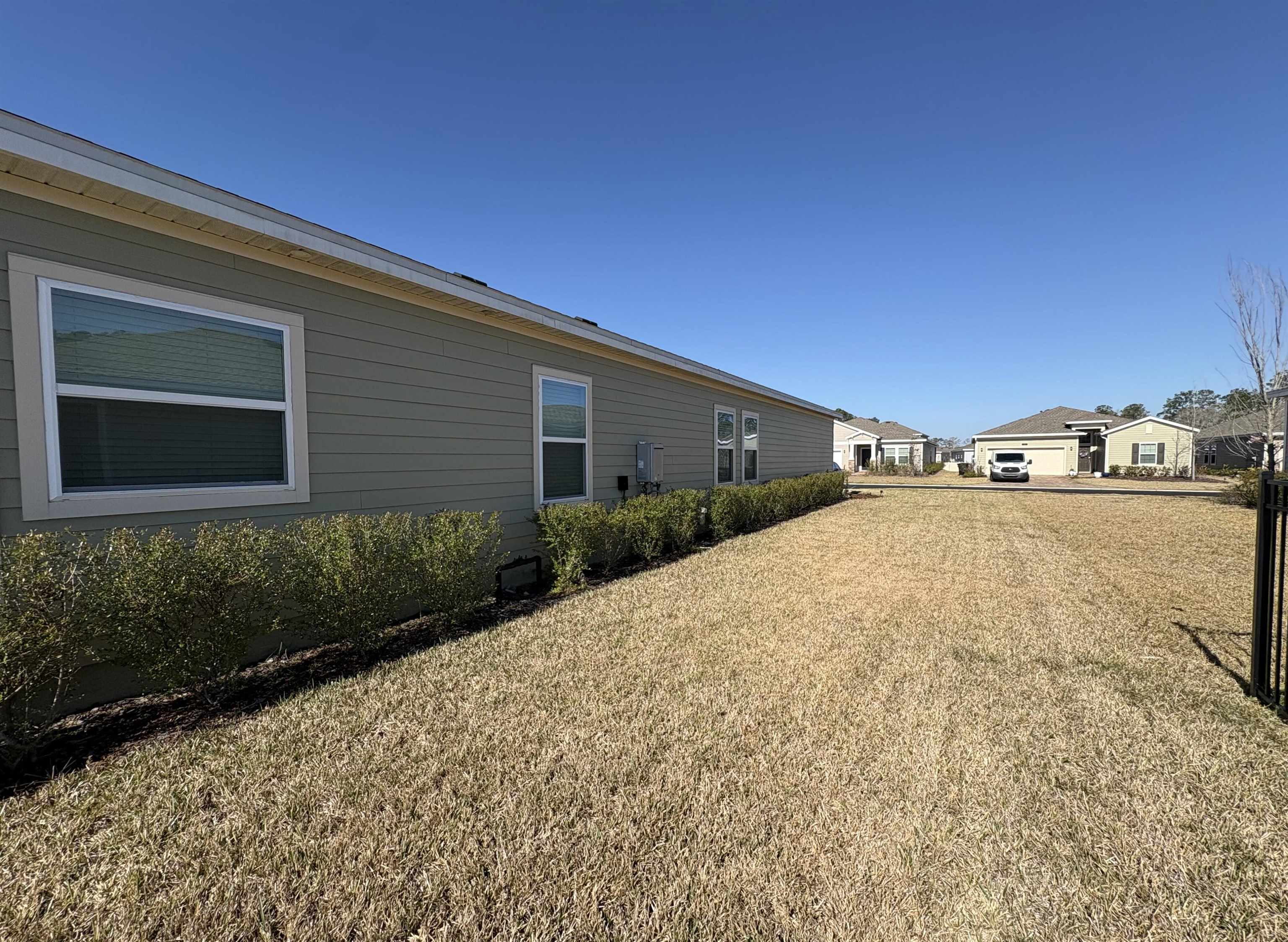 63 Quicksilver Way St. Augustine, FL 32092 - Photo 21 of 36 a front view of a house with a yard