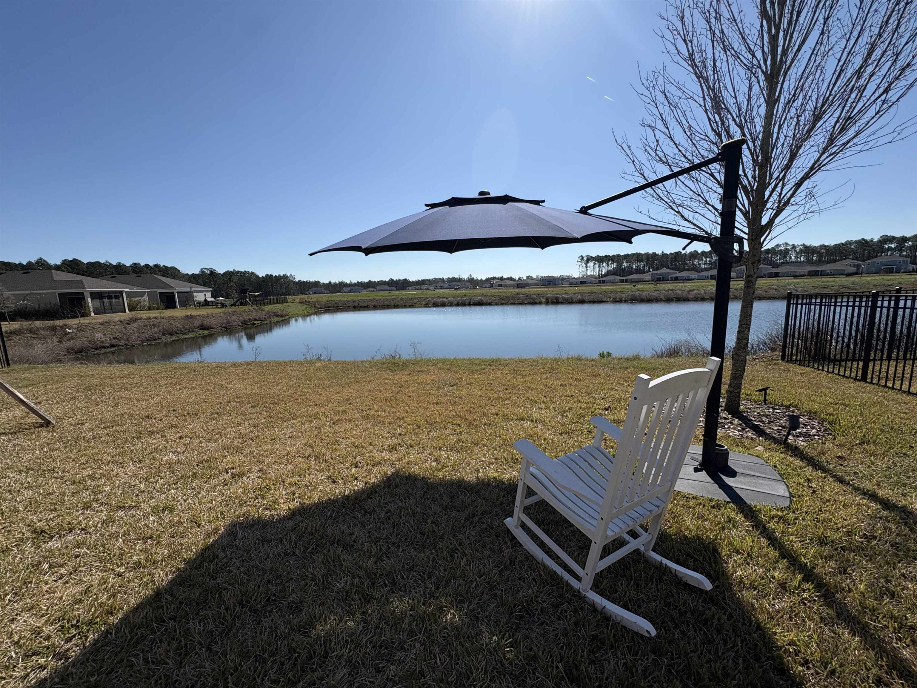 63 Quicksilver Way St. Augustine, FL 32092 - Photo 23 of 36 a view of a swimming pool with a lounge chair