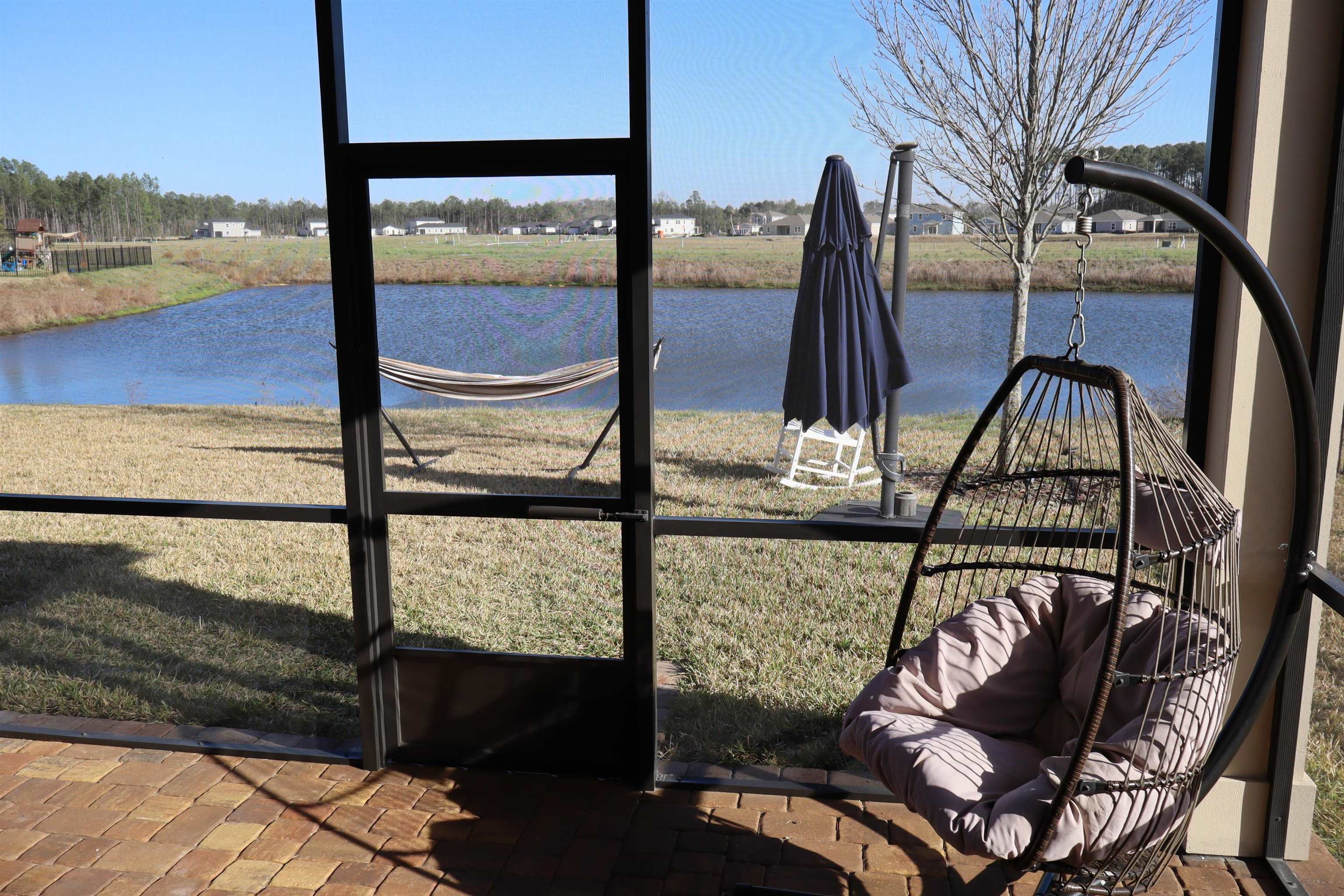 63 Quicksilver Way St. Augustine, FL 32092 - Photo 24 of 36 a view of a balcony with chair and wooden floor