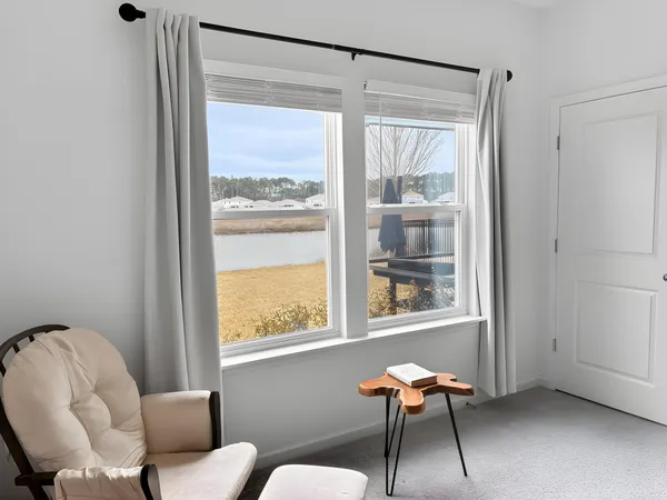 a room with a chair and wooden floor