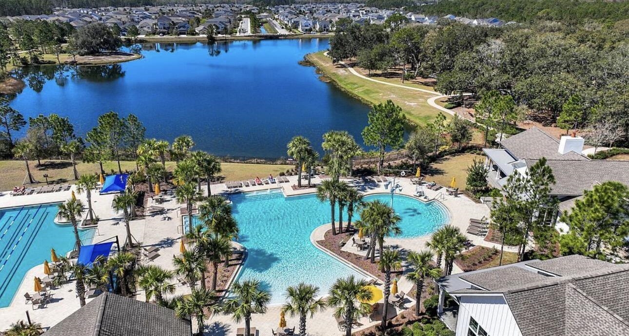 63 Quicksilver Way St. Augustine, FL 32092 - Photo 31 of 36 an aerial view of a house with a yard and lake view