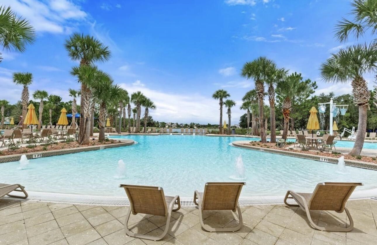 63 Quicksilver Way St. Augustine, FL 32092 - Photo 32 of 36 a view of a lake with outdoor seating