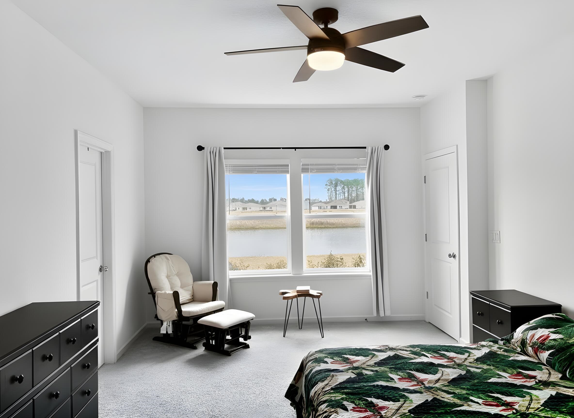 63 Quicksilver Way St. Augustine, FL 32092 - Photo 4 of 36 a bedroom with furniture and a window