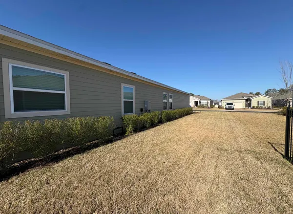 a view of a swimming pool with a lounge chair