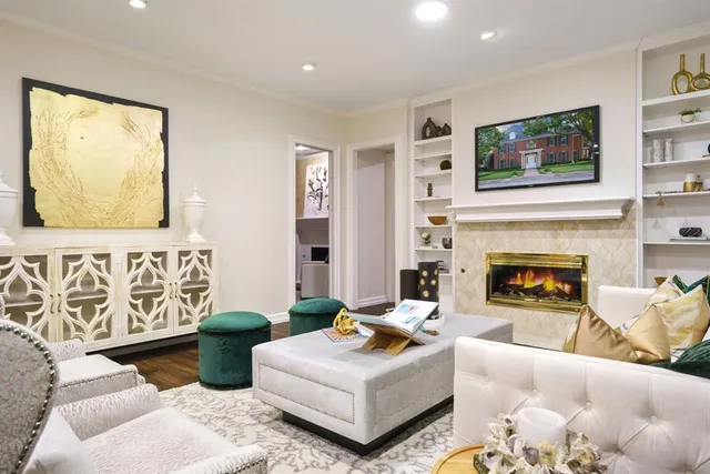 a living room with furniture and a fireplace