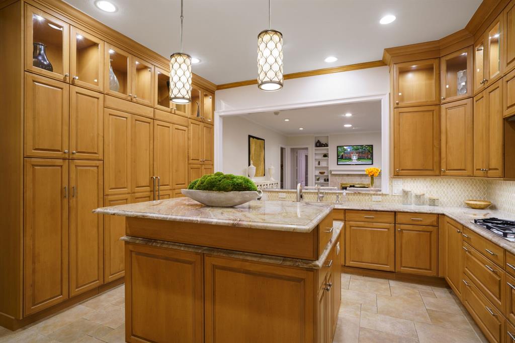7104 Judi Court Dallas, TX 75252 - Photo 17 of 40 a kitchen with a sink and cabinets