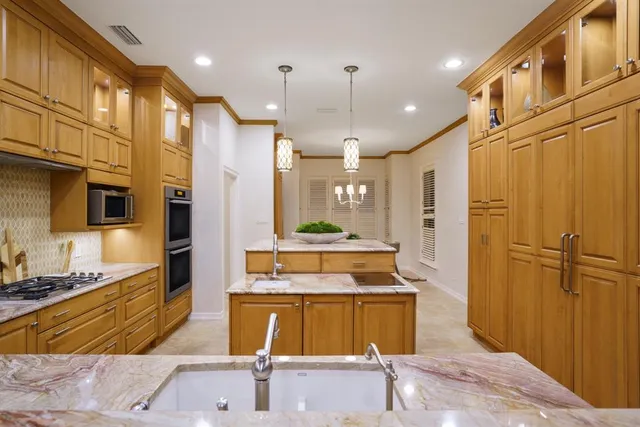 a bathroom with a tub sink shower and mirror