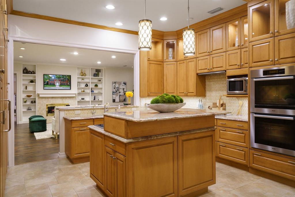7104 Judi Court Dallas, TX 75252 - Photo 19 of 40 a kitchen with a sink and cabinets