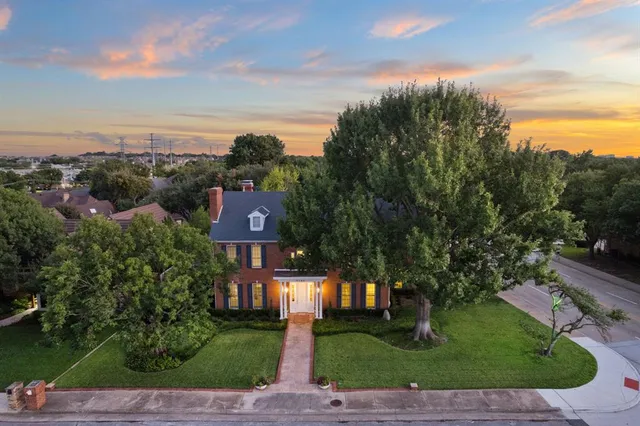 a view of a street with a building in the background