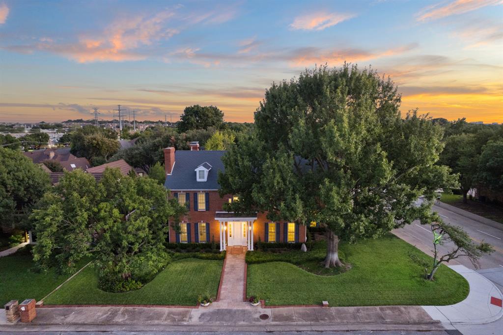 7104 Judi Court Dallas, TX 75252 - Photo 2 of 40 a view of a street with a building in the background