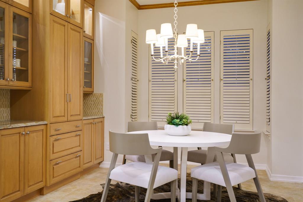 7104 Judi Court Dallas, TX 75252 - Photo 21 of 40 a view of a dining room with furniture and wooden floor