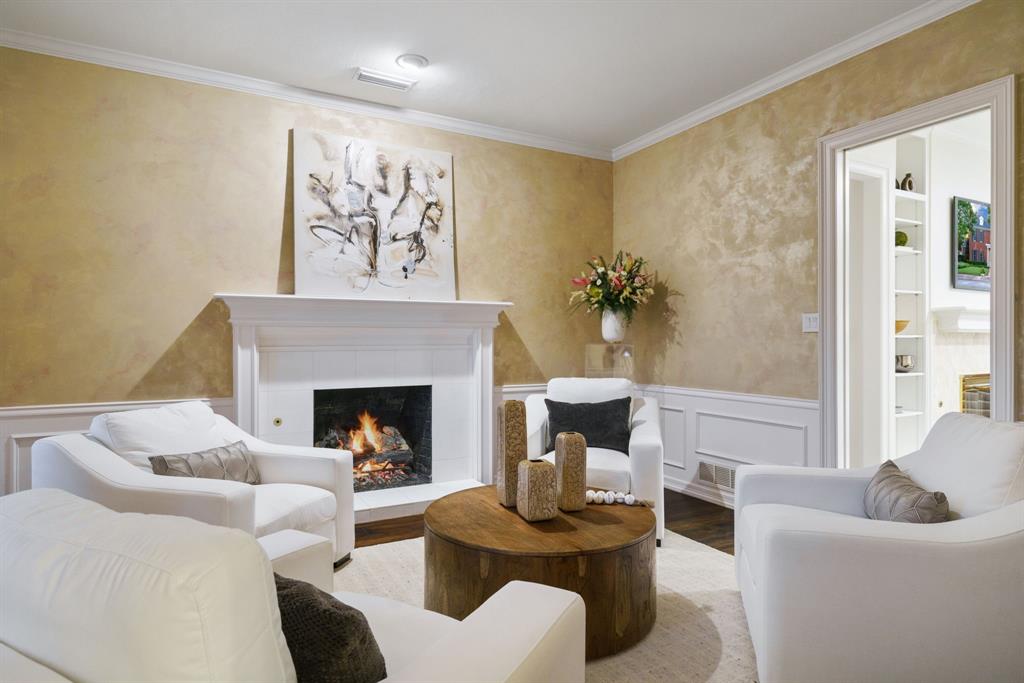 7104 Judi Court Dallas, TX 75252 - Photo 24 of 40 a living room with furniture a fireplace and a potted plant