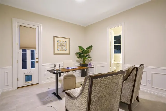 a view of a dining room with furniture and window