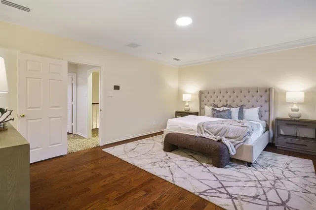 a bedroom with a bed and a walk in closet