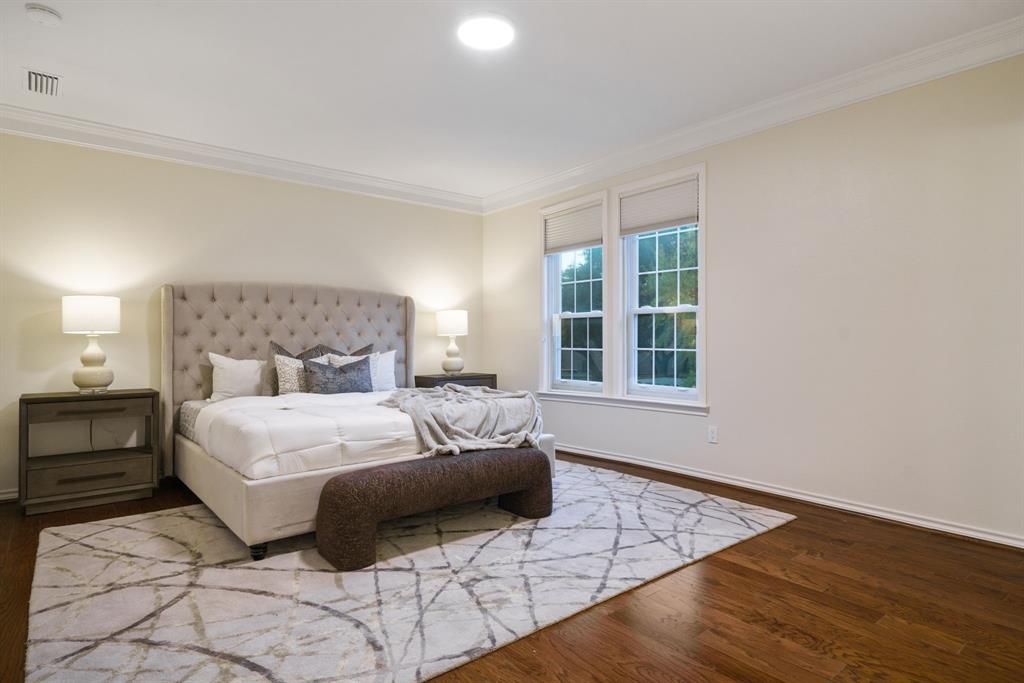 7104 Judi Court Dallas, TX 75252 - Photo 28 of 40 a bedroom with a bed and a window