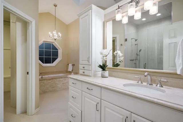 a bathroom with a sink double vanity and a mirror