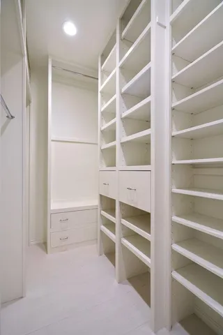 a view of an empty walk in closet