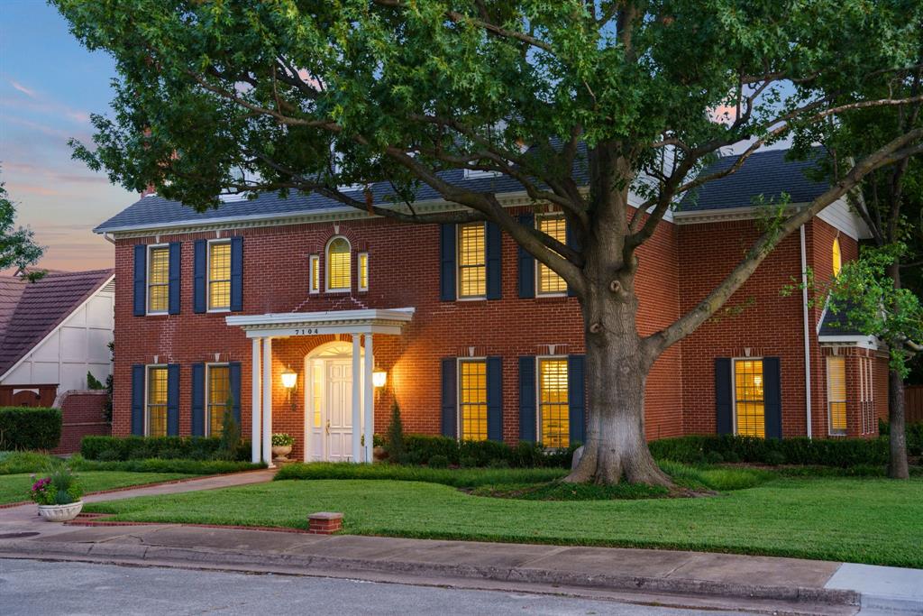 7104 Judi Court Dallas, TX 75252 - Photo 34 of 40 front view of building with a yard
