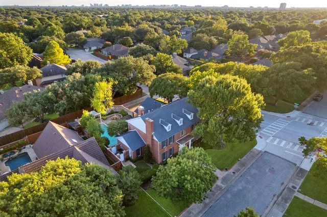 an aerial view of house with yard