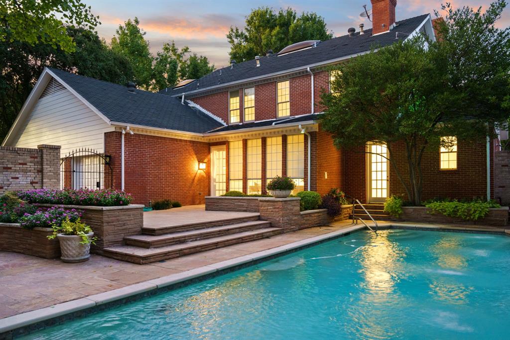 7104 Judi Court Dallas, TX 75252 - Photo 4 of 40 a view of a house with swimming pool and sitting area