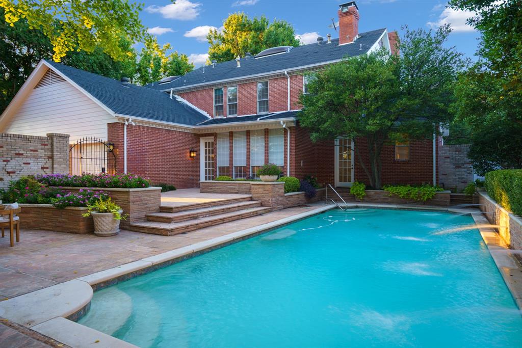 7104 Judi Court Dallas, TX 75252 - Photo 7 of 40 a front view of a house with porch and sitting area