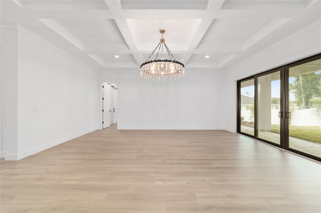 5775 Southwest 43rd Place Ocala, FL 34474 - Photo 11 of 52 a view of an empty room with glass door and windows