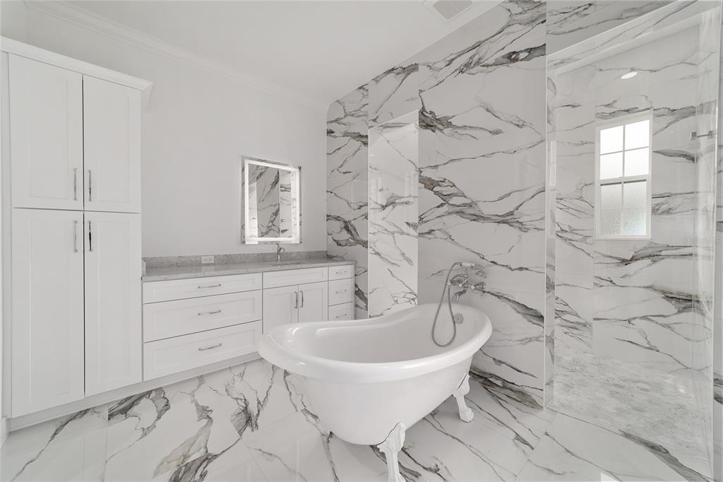 5775 Southwest 43rd Place Ocala, FL 34474 - Photo 29 of 52 a bathroom with a sink and a bathtub