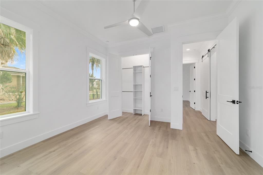 5775 Southwest 43rd Place Ocala, FL 34474 - Photo 31 of 52 a view of an empty room with wooden floor and a window