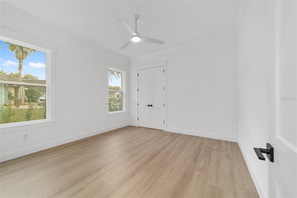 5775 Southwest 43rd Place Ocala, FL 34474 - Photo 35 of 52 wooden floor in an empty room with a window