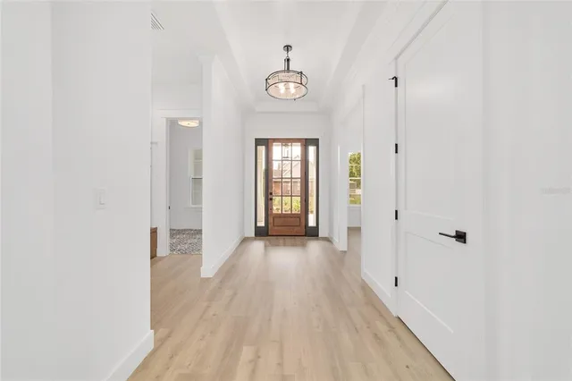 a large kitchen with lots of counter space a sink appliances and dining table