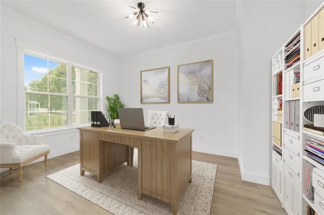 a kitchen with a sink a counter top space stainless steel appliances and cabinets