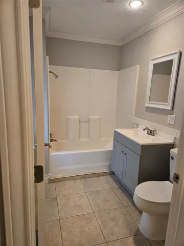 an empty room with windows and entrance