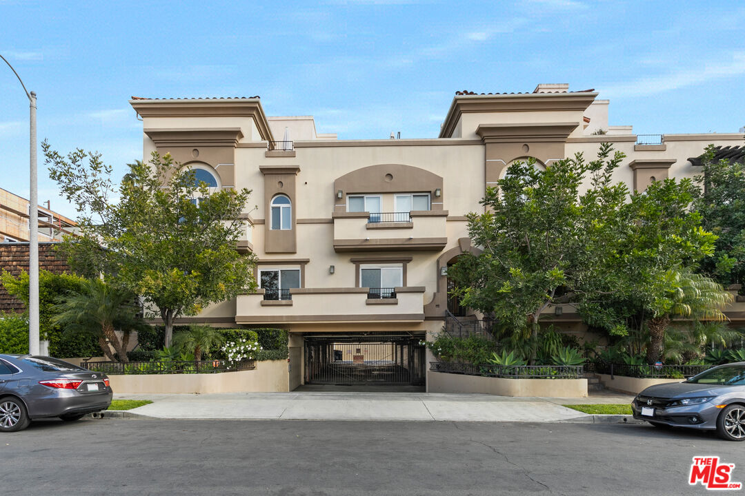 a view of a car parked in front of a building