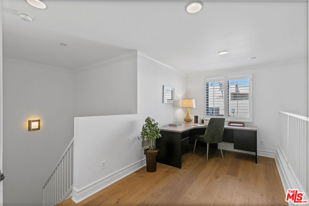 1710 Granville Avenue, Unit 3 Los Angeles, CA 90025 - Photo 11 of 21 a view of a workspace with furniture and a window