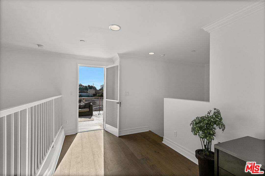 1710 Granville Avenue, Unit 3 Los Angeles, CA 90025 - Photo 13 of 21 wooden floor in an empty room with a window