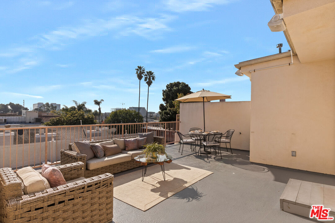 1710 Granville Avenue, Unit 3 Los Angeles, CA 90025 - Photo 14 of 21 an outdoor living room with patio furniture