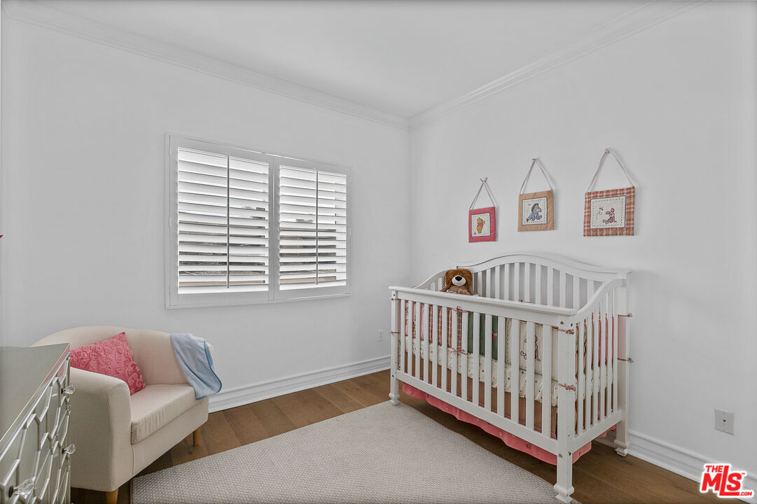 1710 Granville Avenue, Unit 3 Los Angeles, CA 90025 - Photo 15 of 21 a bedroom with furniture and a window