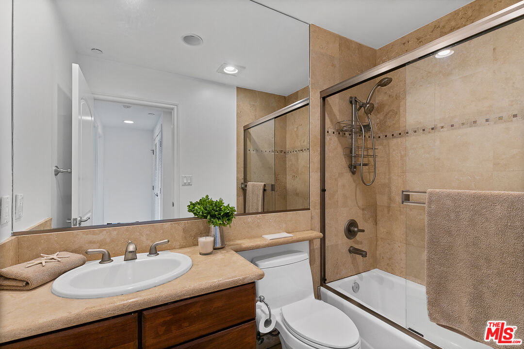1710 Granville Avenue, Unit 3 Los Angeles, CA 90025 - Photo 17 of 21 a bathroom with a sink toilet and shower