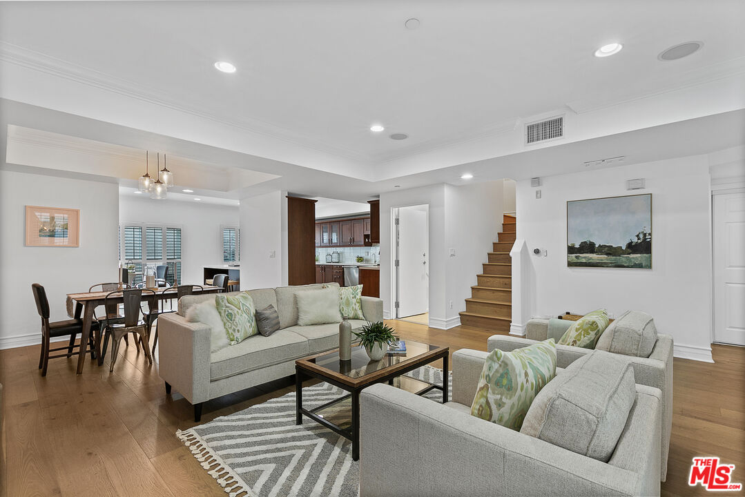 1710 Granville Avenue, Unit 3 Los Angeles, CA 90025 - Photo 4 of 21 a living room with furniture and wooden floor