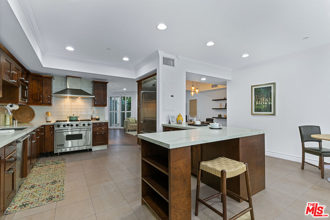 1710 Granville Avenue, Unit 3 Los Angeles, CA 90025 - Photo 6 of 21 a kitchen with counter top space cabinets and stainless steel appliances