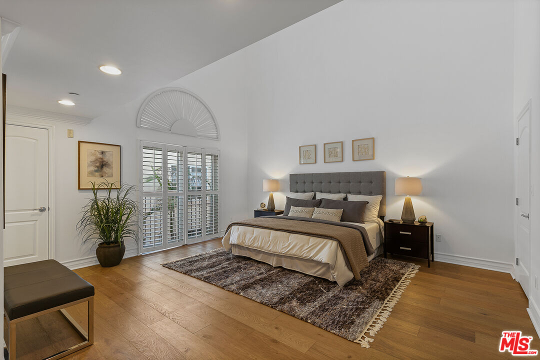 1710 Granville Avenue, Unit 3 Los Angeles, CA 90025 - Photo 8 of 21 a bedroom with a large bed and a window