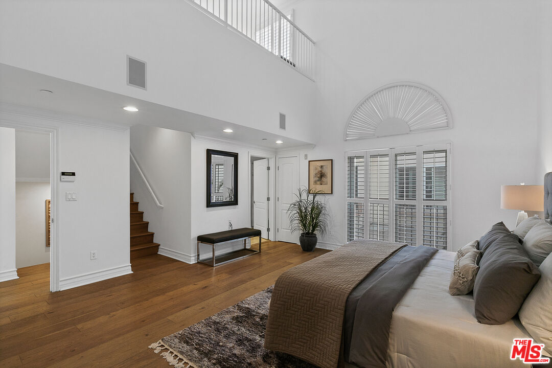 1710 Granville Avenue, Unit 3 Los Angeles, CA 90025 - Photo 9 of 21 a bedroom with a bed and a large window