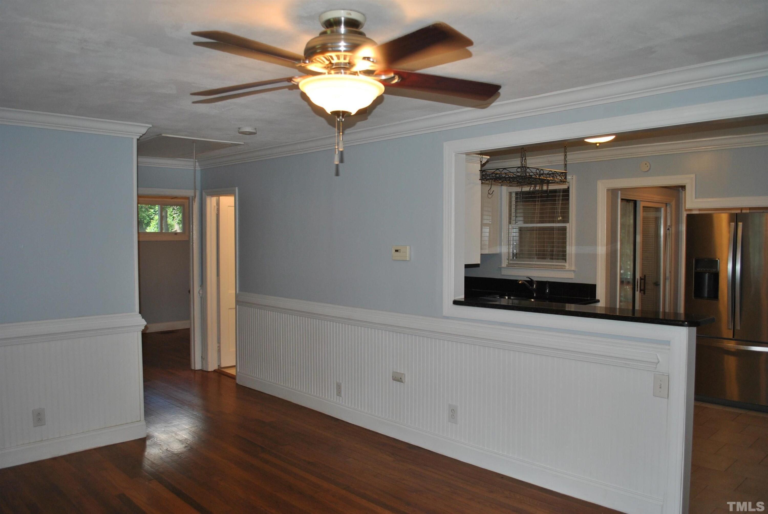 2106 Brewer Street Raleigh, NC 27608 - Photo 20 of 38 wooden floor in an empty room with a window