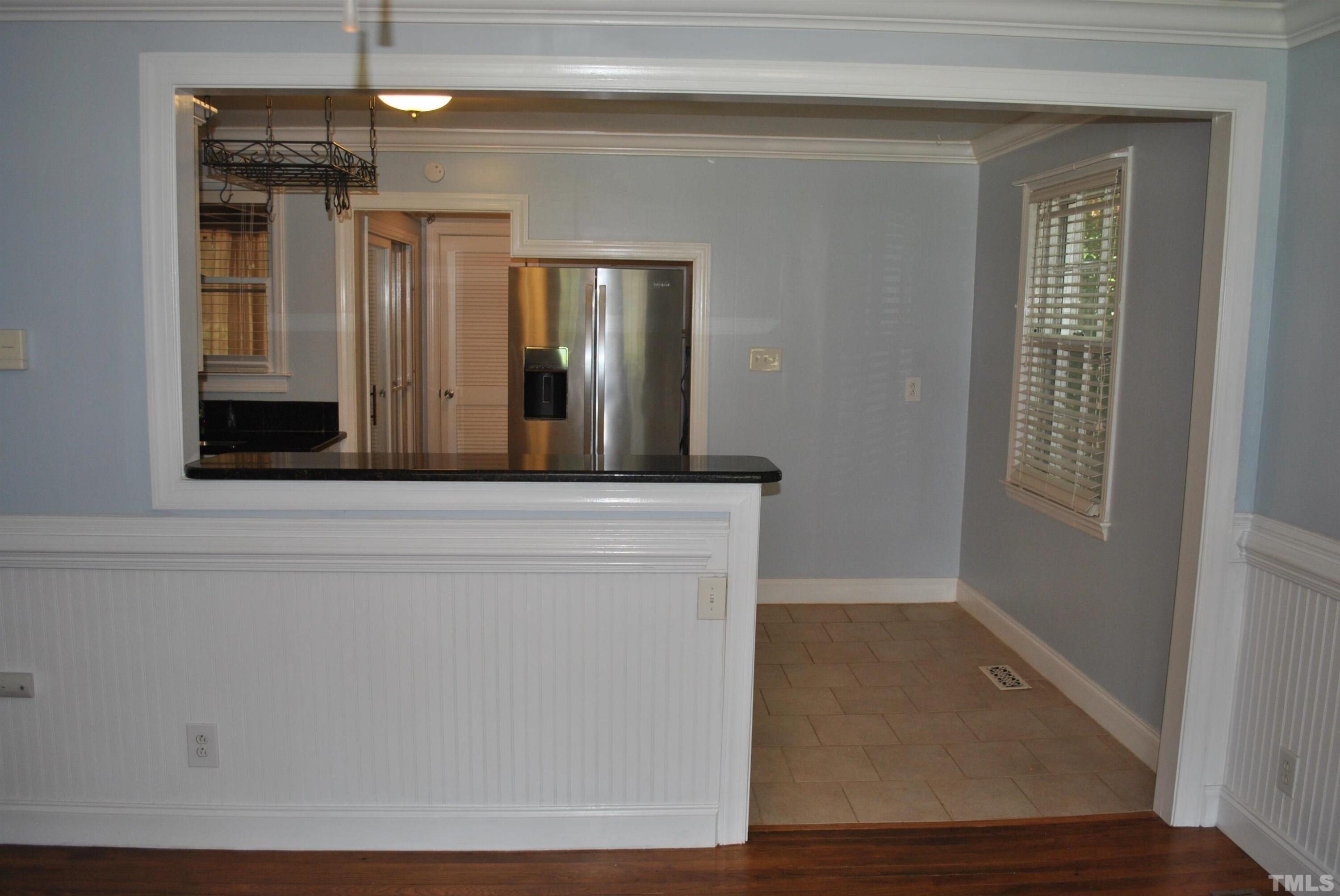 2106 Brewer Street Raleigh, NC 27608 - Photo 23 of 38 a view of a hallway with wooden floor and staircase