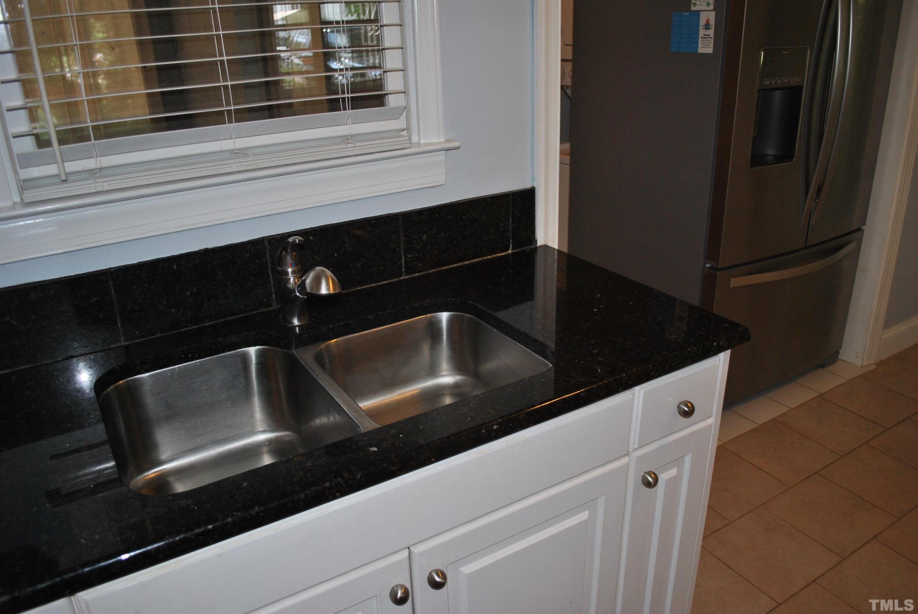 2106 Brewer Street Raleigh, NC 27608 - Photo 25 of 38 a close view of kitchen sink and stove